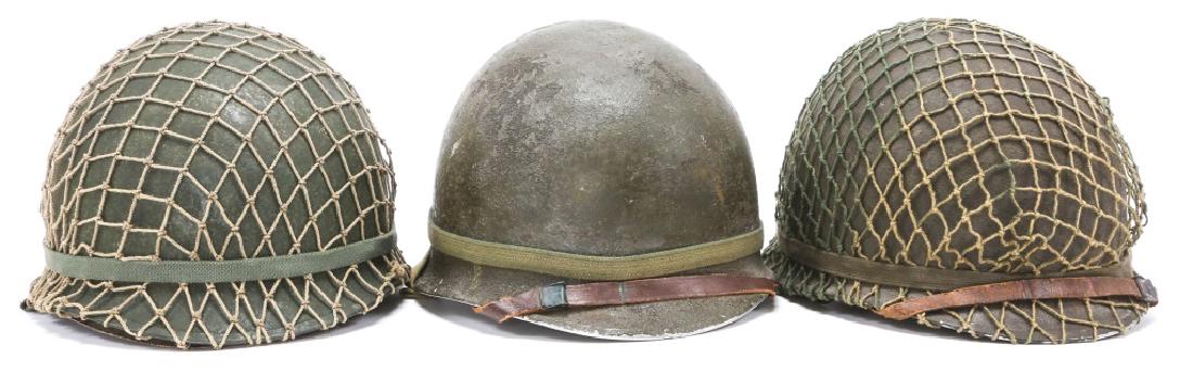 WWII US M1 HELMET LOT OF 3: WWII US M1 HELMET LOT OF 3 Front seam, swivel bale, and later liners. Two include mesh covers.