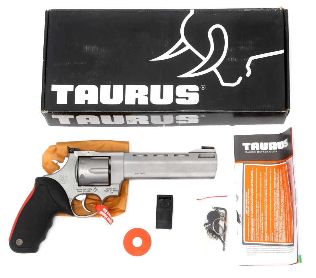 TAURUS RAGING BULL .44 MAGNUM REVOLVER: TAURUS RAGING BULL .44 MAGNUM REVOLVER Original box and accessories. Model: Raging Bull Caliber / Gauge: .44 MAG Barrel Length: 6.5" Serial Number: JU970900