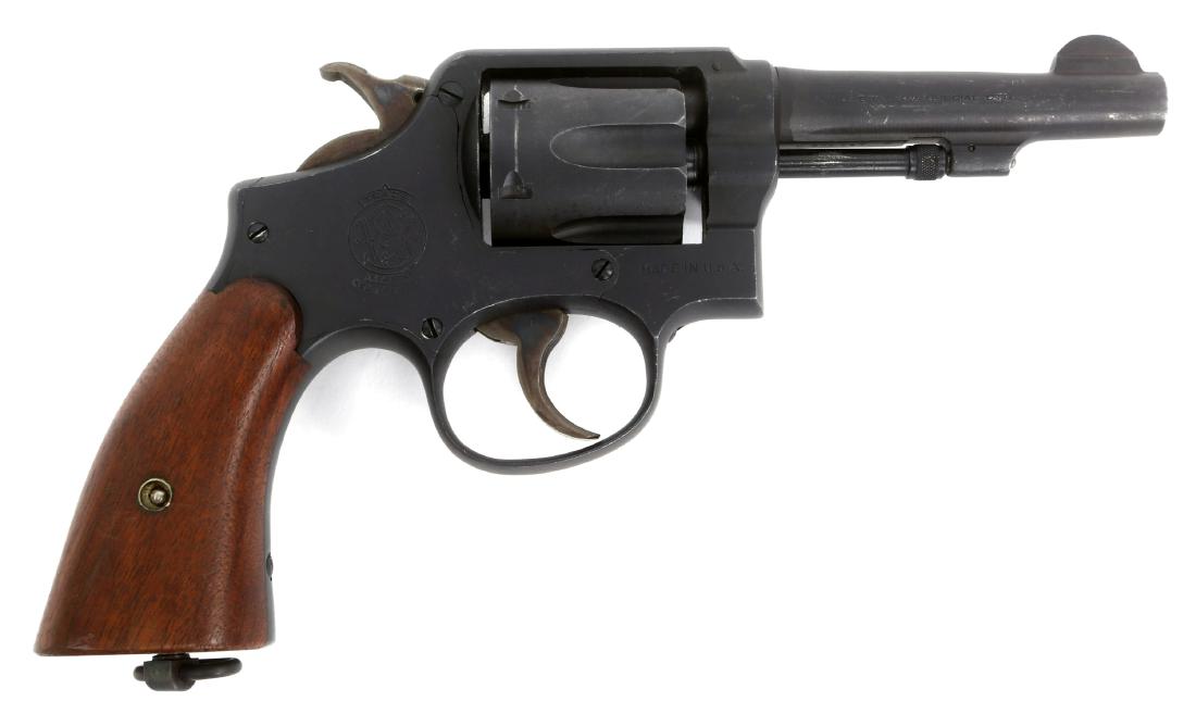 SMITH & WESSON VICTORY MODEL .38 SPECIAL REVOLVER: SMITH & WESSON VICTORY MODEL .38 SPECIAL REVOLVER Flaming bomb proof on bottom of grip tang near serial number. Model: Victory Caliber / Gauge: .38 Special Barrel Length: 4" Serial Number: 460049