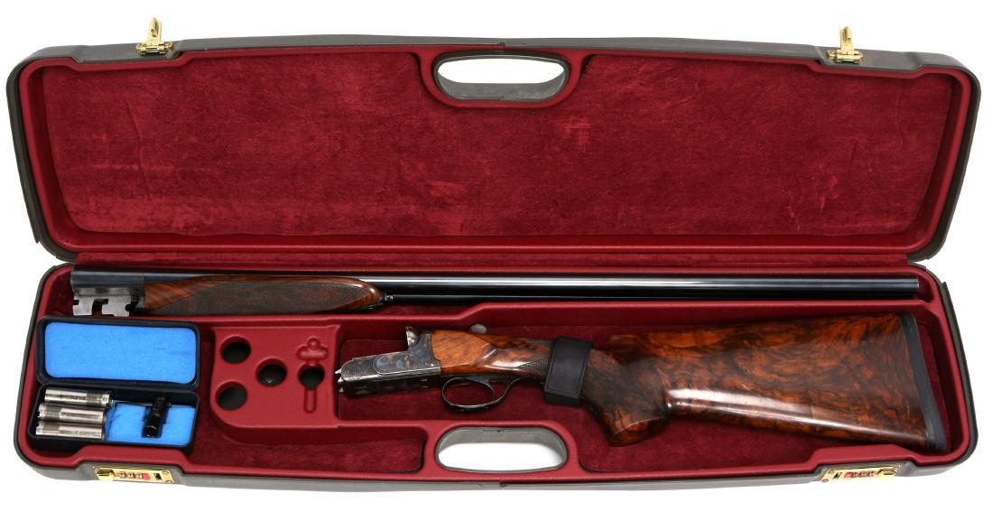 FRATELLI POLI ARMI SPORTING 20 GAUGE SHOTGUN: FRATELLI POLI ARMI SPORTING 20 GAUGE SHOTGUN Fratelli Poli Armi Sporting side by side 20 gauge shotgun. Cole Inc stamp. Caesar Guerini case with choke set. Model: Sporting Caliber / Gauge: 20 GA Barre