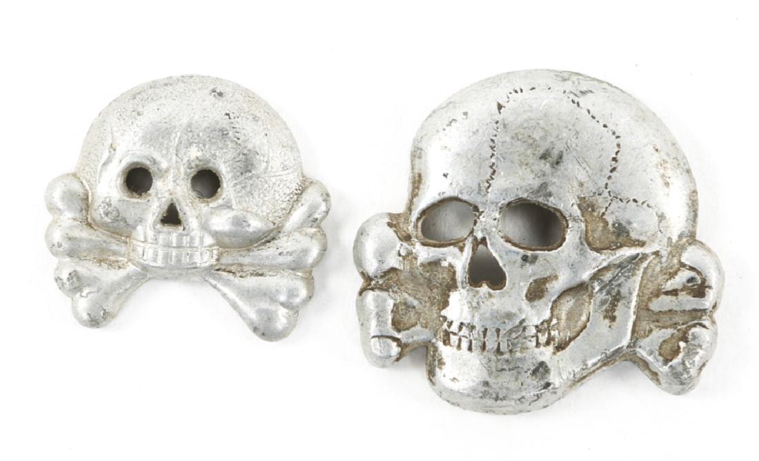 WWII GERMAN SS CAP SKULL 1st & 2nd PATTERN LOT: WWII GERMAN SS CAP SKULL 1st & 2nd PATTERN LOT 1- Second pattern, Aluminum, maker RZM M1/52. 1- First pattern small size, aluminum, unmarked.