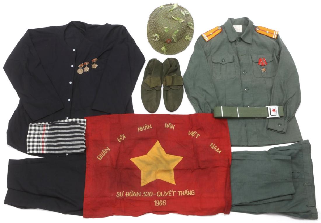 VIETNAM WAR NVA & VIETCONG UNIFORM WIT FLAG LOT: VIETNAM WAR NVA & VIETCONG UNIFORM WIT FLAG LOT Vietnam War NVA Officer field green uniform, tunic, pants, belt, hat and field shoes. Vietcong black pajamas, shirt , pants and scarf. 1966 Vietnam batt