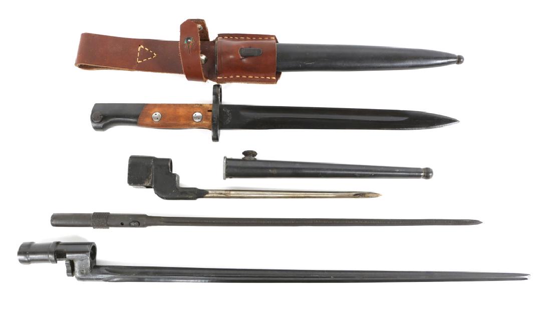 WORLD BAYONET LOT OF 4: WORLD BAYONET LOT OF 4 1 - Yugoslavian Mauser bayonet with scabbard and frog, blade size 9.1/2", overall size: 14.3/4". 1 - British spike bayonet. 1 - Russian Nagant bayonet. 1 - French MAS36 bayonet.