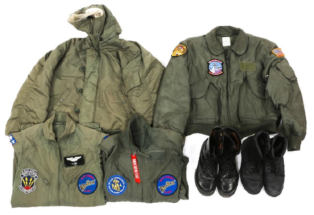 USAF FLIGHT JACKET & FLIGHT SUIT MIXED LOT: USAF FLIGHT JACKET & FLIGHT SUIT MIXED LOT USAF, flight jacket 45/p with patches, size XL. Flight Jacket with hood N-2B, size XL. Two flight suits with patches. Rocky flight boots 9.1/2. Leather fligh