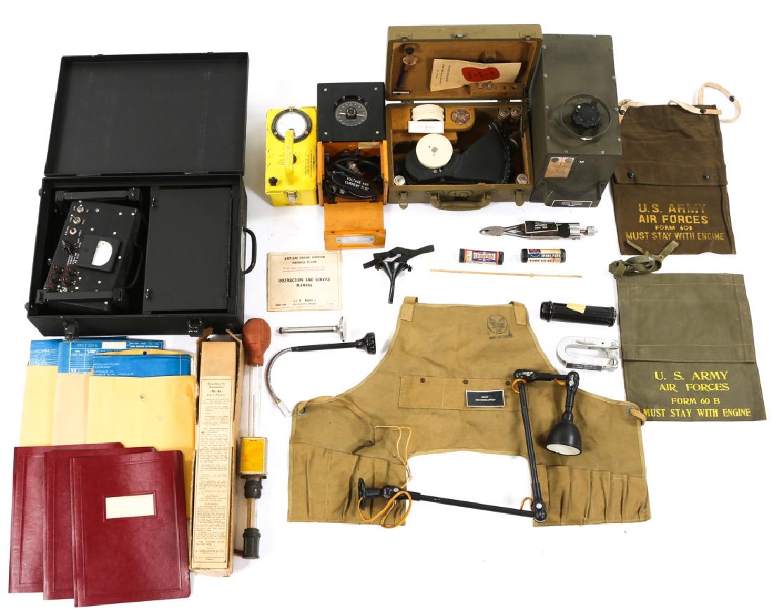 WWII US TOOL AND TEST KIT LARGE LOT: WWII US TOOL AND TEST KIT LARGE LOT WWII US tool and test kit large lot. Includes Safety wire pliers, aircraft spark plugs in original boxes, work bench light, ignition harness tester, engine power sc