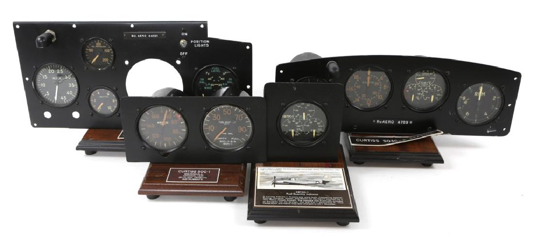 WWII CURTISS AIRCRAFT INSTRUMENT PANEL LOT OF 4: WWII CURTISS AIRCRAFT INSTRUMENT PANEL LOT OF 4 Instrument panels and indicators for various Curtis aircraft including, SOC-1 Seagull, SO3C-2 Seamew, XBT2C-1 fuel indicator, and reduced size model des