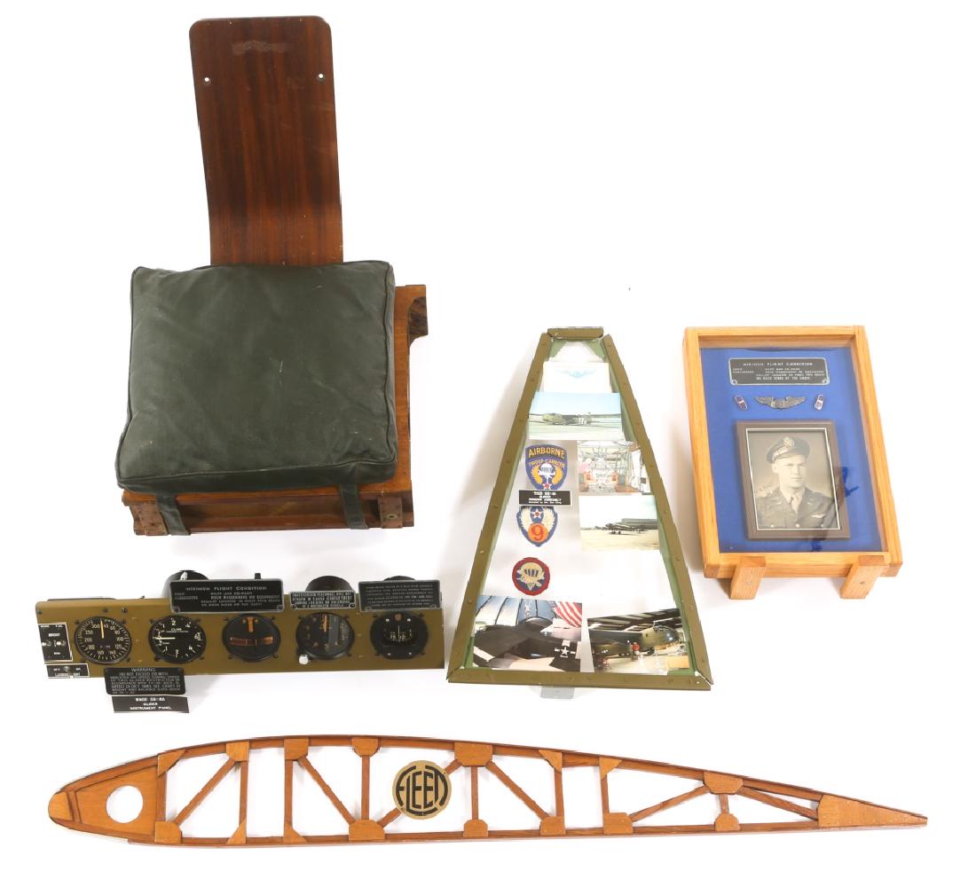 WWII WACO CG-4A GLIDER INSTRUMENT & SEAT MIXED LOT: WWII WACO CG-4A GLIDER INSTRUMENT & SEAT MIXED LOT WWII Waco CG-4A glider instrument panel, pilot seat cushion, windows assembly and framed glider pilot's wings and signed picture.