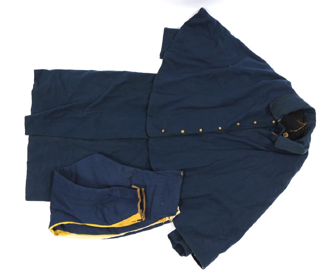 US ARMY M1885 CAVALRY OVERCOAT CAPE AND PANTS: US ARMY M1885 CAVALRY OVERCOAT CAPE AND PANTS Indian Wars, US Army M1885 Cavalry ridding overcoat & cape, identified , N.Y State buttons. Dress Blue Infantry breeches re-tailored with yellow stripe. S