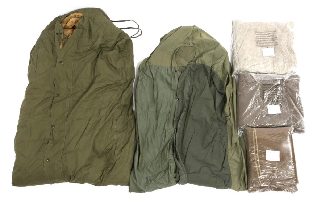 KOREAN WAR US ARMY DOWN SLEEPING BAG AND BLANKETS: KOREAN WAR US ARMY DOWN SLEEPING BAG AND BLANKETS One WWII - Korean War down filled sleeping bag, dated "April 6, 1951," one USMC waterproof sleeping bag cover, three Korea - Vietnam War wool blankets