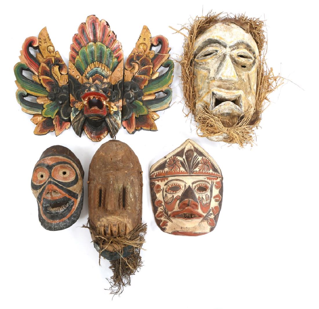 OCEANIC CEREMONIAL MASK LOT OF 5: OCEANIC CEREMONIAL MASK LOT OF 5 Ceremonial masks of various Oceanic tribes and cultures. Two carved wood masks, two ceramic masks, and three piece painted wooden souvenir Indonesian head piece.