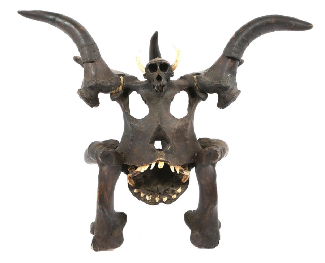 LARGE BONE IFUGAO SHAMAN MASK: LARGE BONE IFUGAO SHAMAN MASK Large shamans mask made from boars jaw, water buffalo bone, and monkey skull. Size: 20" X 24" X 21"