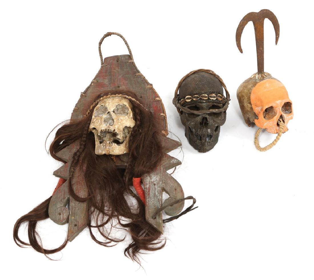 DAYAK IBAN TROPHY SKULL MODEL LOT OF 3: DAYAK IBAN TROPHY SKULL MODEL LOT OF 3 Three resin models of trophy skulls of the Iban people of Borneo. Decorated skulls with hair, crab claws, and paint. Size: 9"-28"