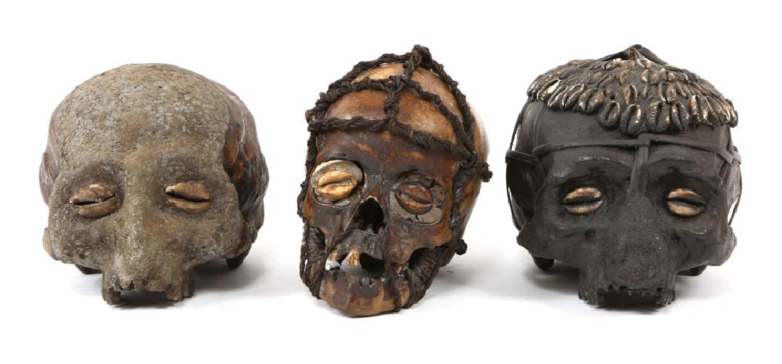 DAYAK IBAN TROPHY SKULL MODEL LOT OF 3: DAYAK IBAN TROPHY SKULL MODEL LOT OF 3 Three resin models of decorated trophy human skulls from the Iban people of Borneo. Size: 6.5" X 7.5"