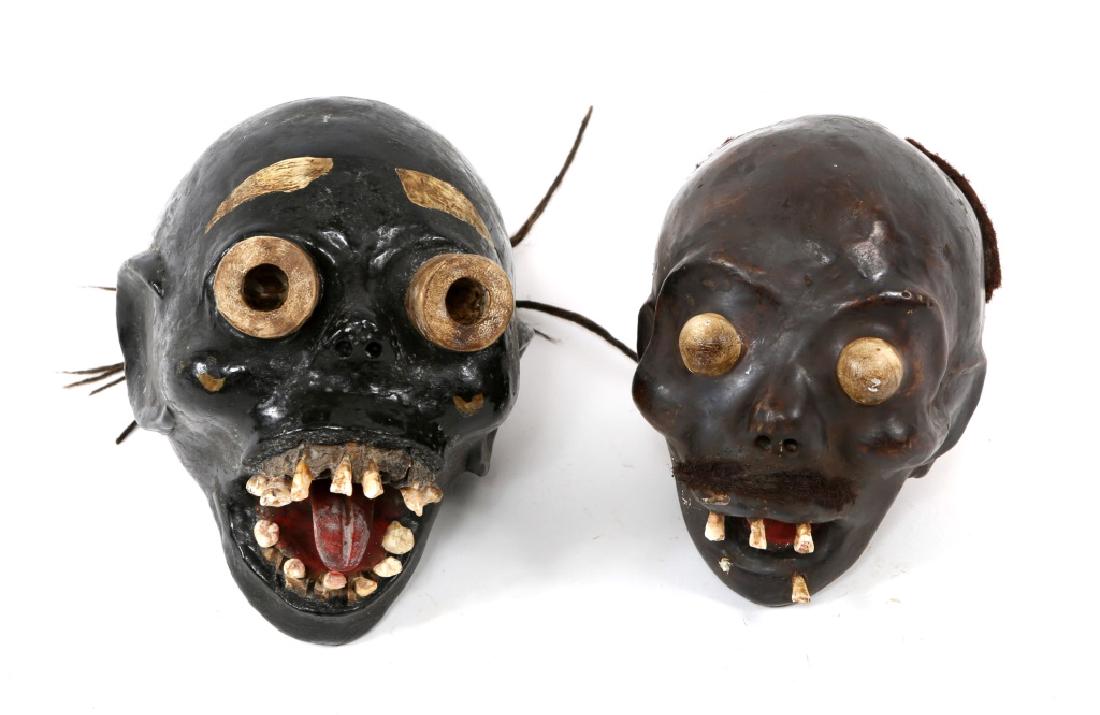AFRICAN EKOI SKULL WITH MASK MODEL LOT OF 2: AFRICAN EKOI SKULL WITH MASK MODEL LOT OF 2 Two resin models of human skulls with over modeled masks made by Ekoi people of Nigeria. Size: 8" X 8"