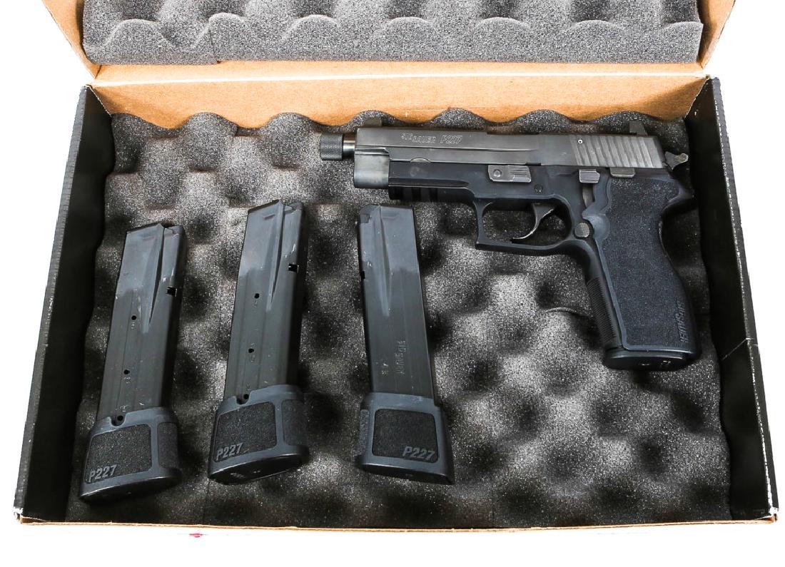 SIG SAUER MODEL P227 PISTOL .45 CALIBER: SIG SAUER MODEL P227 PISTOL .45 CALIBER Four magazines. Threaded barrel. In original box. Model: P227 Caliber / Gauge: .45 Barrel Length: 5" Serial Number: 51B026384