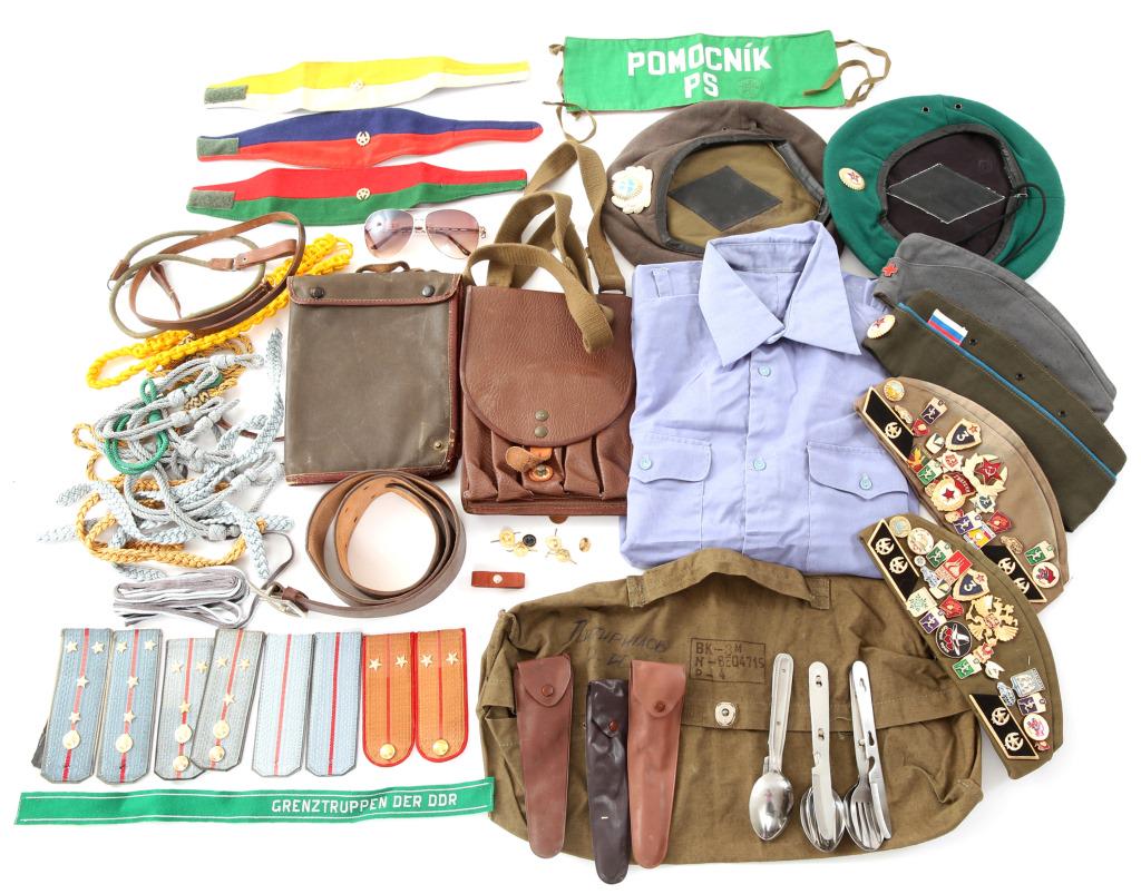COLD WAR RUSSIAN & EAST GERMAN UNIFORM ITEM LOT: COLD WAR RUSSIAN & EAST GERMAN UNIFORM ITEM LOT Mixed lot of East German marksman cords, hat bands, overseas caps. Russian shoulder boards, armbands, flare case, belt, utensils.