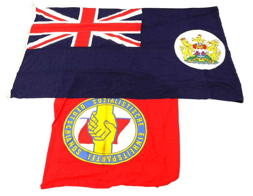 BRITISH ROYAL HONG KONG & EAST GERMAN FLAG LOT: BRITISH ROYAL HONG KONG & EAST GERMAN FLAG LOT 1970s British Royal Hong Kong flag 53"X11", and Cold War era East German 46"X155"