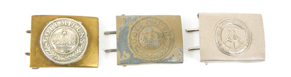 WWI PRUSSIAN ARMY & EAST GERMAN BELT BUCKLE LOT: WWI PRUSSIAN ARMY & EAST GERMAN BELT BUCKLE LOT Two WWI Prussian Army "Gott Mit Uns" belt buckles, and one East German Army belt buckle.