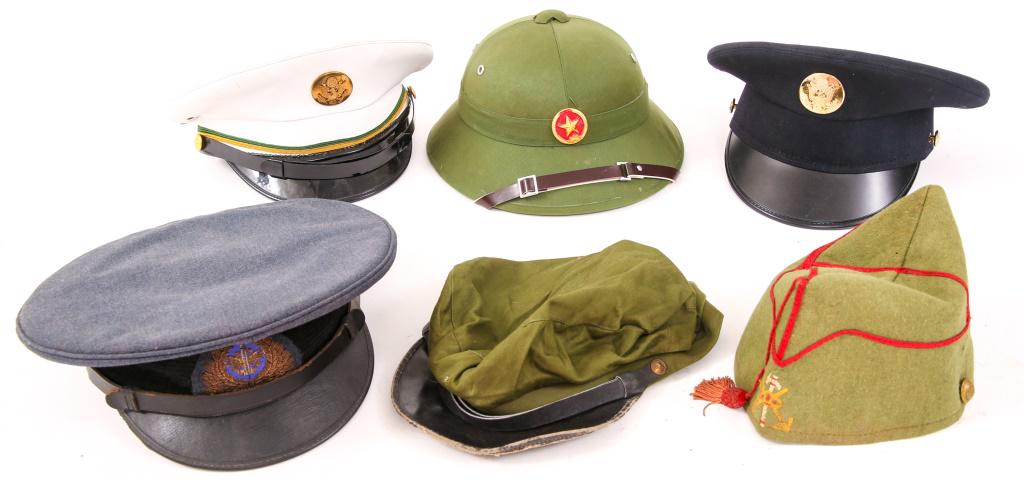 WORLD & US MILITARY HEADGEAR LOT OF 6: WORLD & US MILITARY HEADGEAR LOT OF 6 World Military headgear, lot of five. 2- US Army MP and enlisted. 1- Kuwait Air Force flight engineer. 1- NVA pith helmet. 1- Spain cap. 1- Chinese communist.