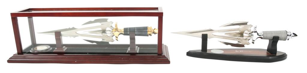 HIBBEN KNIVES TITAN GOLD & SILVER EDITION LOT: HIBBEN KNIVES TITAN GOLD & SILVER EDITION LOT Hibben Knives, Titan Limited Gold edition # 1378 / 1500 with 21" x 6" x 7" display case. Titan " silver " edition, unnumbered with wooded display stand. B