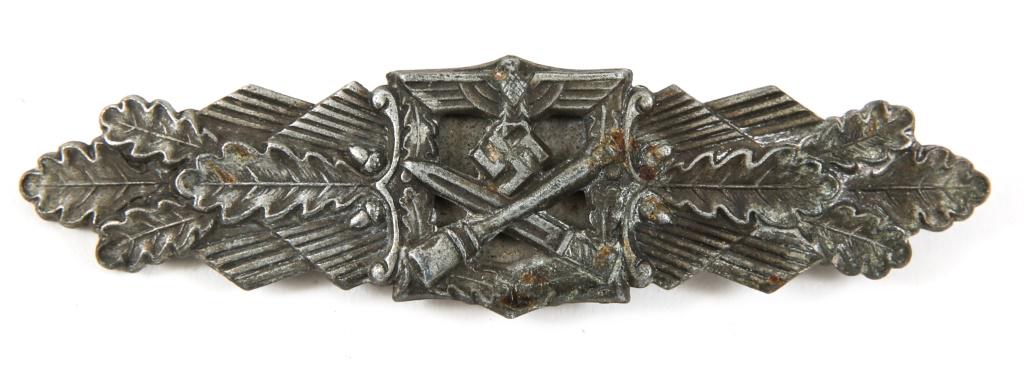 WWII GERMAN ARMY CLOSE COMBAT CLASP BY FLL: WWII GERMAN ARMY CLOSE COMBAT CLASP BY FLL WWII German Bronze CCC by FLL , constructed out of a die struck zinc-alloy base. The obverse depicts a crossed model 24 grenade and K98 bayonet with oak leav