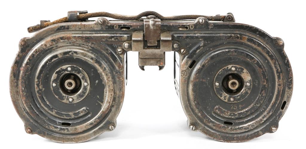 WWII GERMAN MG15 TWIN SADDLE DRUM MAGAZINE: WWII GERMAN MG15 TWIN SADDLE DRUM MAGAZINE Magazine reads: "Wa41 D-T15 Nr25390L F1 46300." Early WWII German 75rd saddle drum MG15 magazine. Original canvas strap. Size / Gauge: 8mm