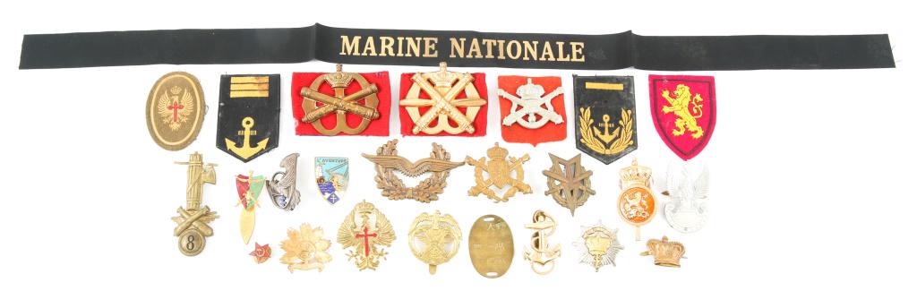 WORLD MILITARY ARMY & NAVY INSIGNIA LOT OF 25: WORLD MILITARY ARMY & NAVY INSIGNIA LOT OF 25 WWII - Cold War, World Military Army and Navy insignia, lot of 25. Includes French Navy; Spanish Artillery; Soviet; WWII Italian Artillery; Japanese Navy 