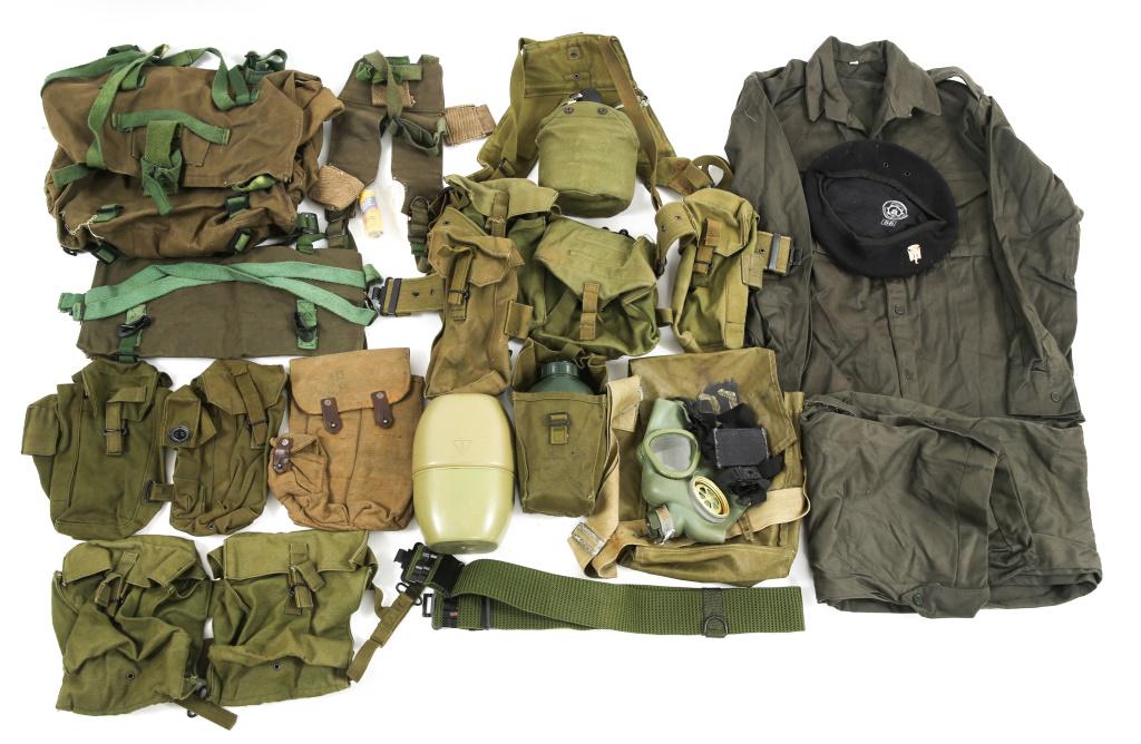 DESERT STORM IRAQI ARMY FIELD GEAR LOT: DESERT STORM IRAQI ARMY FIELD GEAR LOT Desert Storm Iraqi Army field gear lot. Includes 3 canteens, pack, belt, 5 pouches, 1 harness with pouches, and 1 pair of pants, shirt and beret.