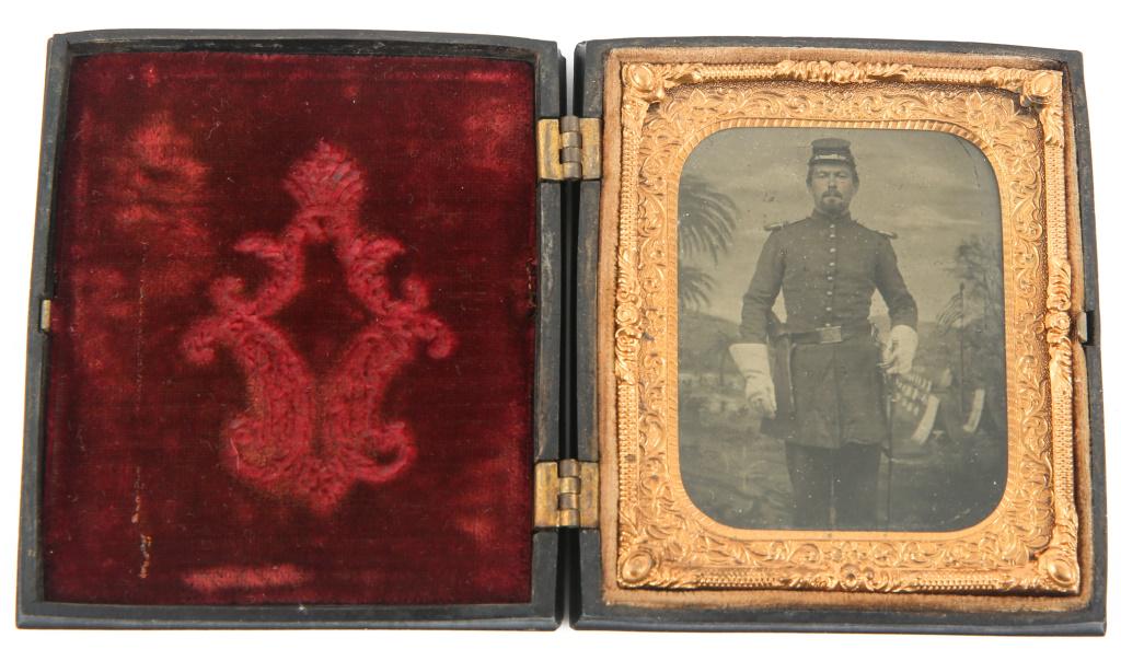 CIVIL WAR UNION OFFICER TIN TYPE PHOTOGRAPH: CIVIL WAR UNION OFFICER TIN TYPE PHOTOGRAPH Civil War Union officer tin type photograph. Soldier is in uniform with revolver and sword. He is standing in front of a painting of an army camp with trees