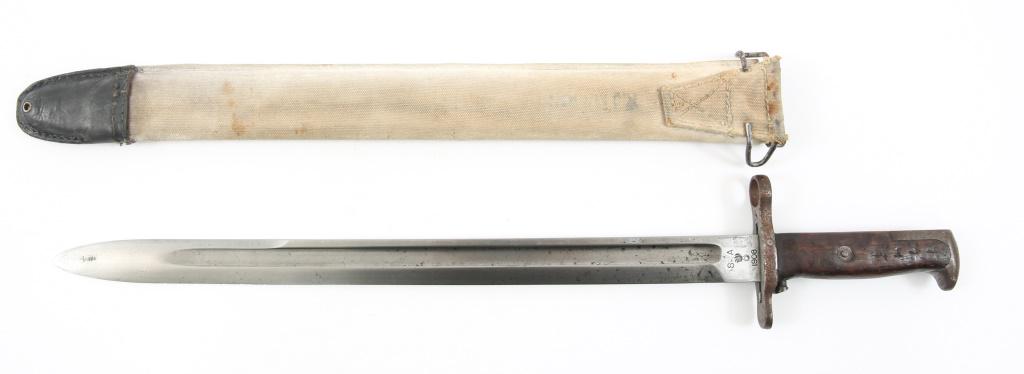 US MODEL 1905 SPRINGFIELD BAYONET DATED 1908: US MODEL 1905 SPRINGFIELD BAYONET DATED 1908 US Army and Marine Corps Model 1905 bayonet, with khaki / white scabbard, retaining hook and throat clip intact. Marked "SA" and "1908" with US Ordnance "b