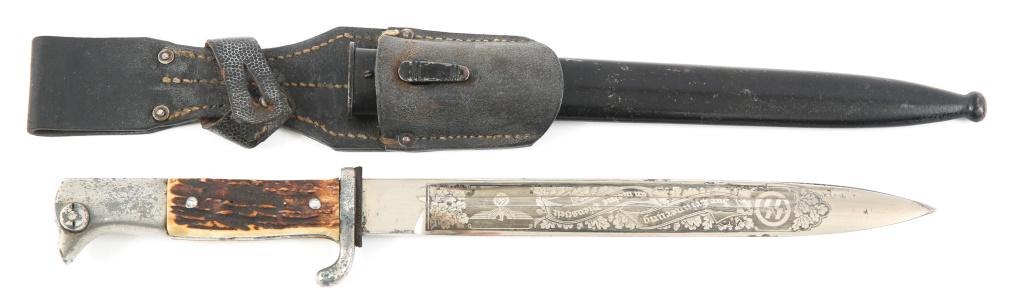 WWII GERMAN K98 DRESS BAYONET WITH STAG GRIP: WWII GERMAN K98 DRESS BAYONET WITH STAG GRIP WWII German K98 bayonet with stag grip, steel scabbard and leather frog. Post war acid etched " SS theme" on both sides of the blade. Blade Length: 9.3/4" 