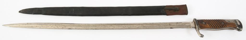 WWI IMPERIAL GERMAN M1898 BAYONET: WWI IMPERIAL GERMAN M1898 BAYONET WWI Imperial German Model 1898 bayonet by WKC. Includes a mismatch leather scabbard, length 18.1/2", throat opening 1". Blade Length: 20.3/4" Overall Length: 25.7/8"