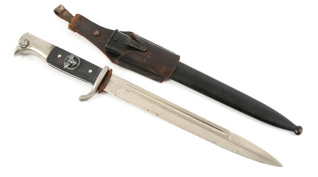 WWII GERMAN DRESS BAYONET WITH NSFK INSIGNIA: WWII GERMAN DRESS BAYONET WITH NSFK INSIGNIA WWII German dress bayonet with steel scabbard. Logo maker mark " WKC " on the ricasso. NSFK insignia on the front grip. Leather frog with hook modification