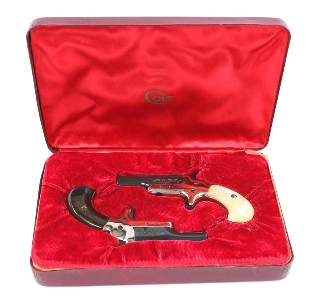 COLT DERRINGER 4th MODEL .22 SHORT PISTOL LOT OF 2: COLT DERRINGER 4th MODEL .22 SHORT PISTOL LOT OF 2 Two Colt 4th Model Derringer pistols, in original display case. One derringer has pearl grips, the other walnut. Spur triggers, side swing action, co
