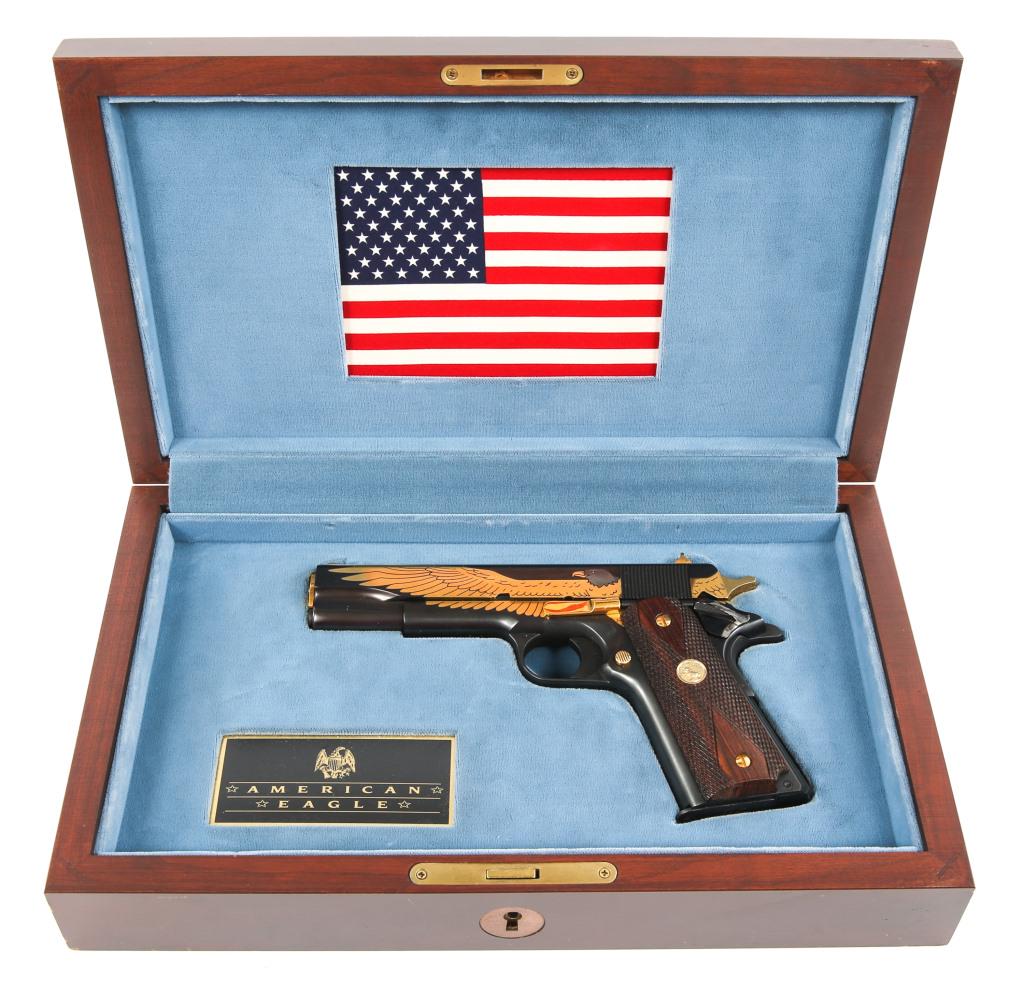 COLT MODEL 1911 THE AMERICAN EAGLE EDITION PISTOL: COLT MODEL 1911 THE AMERICAN EAGLE EDITION PISTOL Colt model 1911 The American Eagle collectors edition .45 ACP pistol, in wooden display box. One magazine. Black finish with 24k gold plated eagle, me