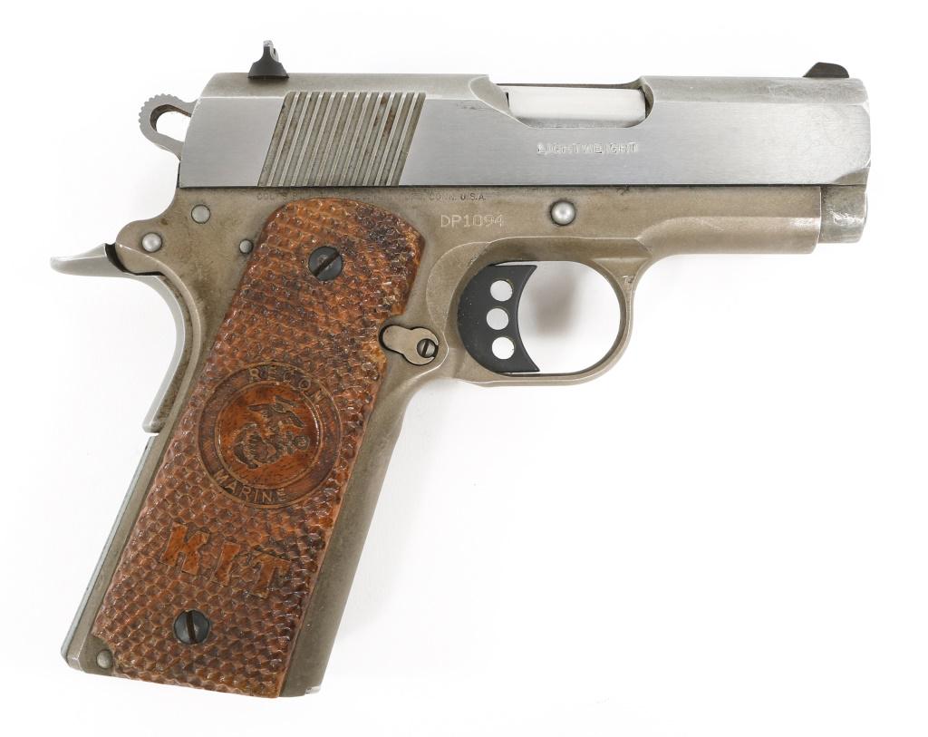 COLT DEFENDER PLUS SERIES 90 LIGHTWEIGHT 45 PISTOL: COLT DEFENDER PLUS SERIES 90 LIGHTWEIGHT 45 PISTOL Colt Defender Plus Series 90 Lightweight .45 ACP pistol, in original Colt hard case. Model number 07860D. Custom plastic grips with scalloped texture