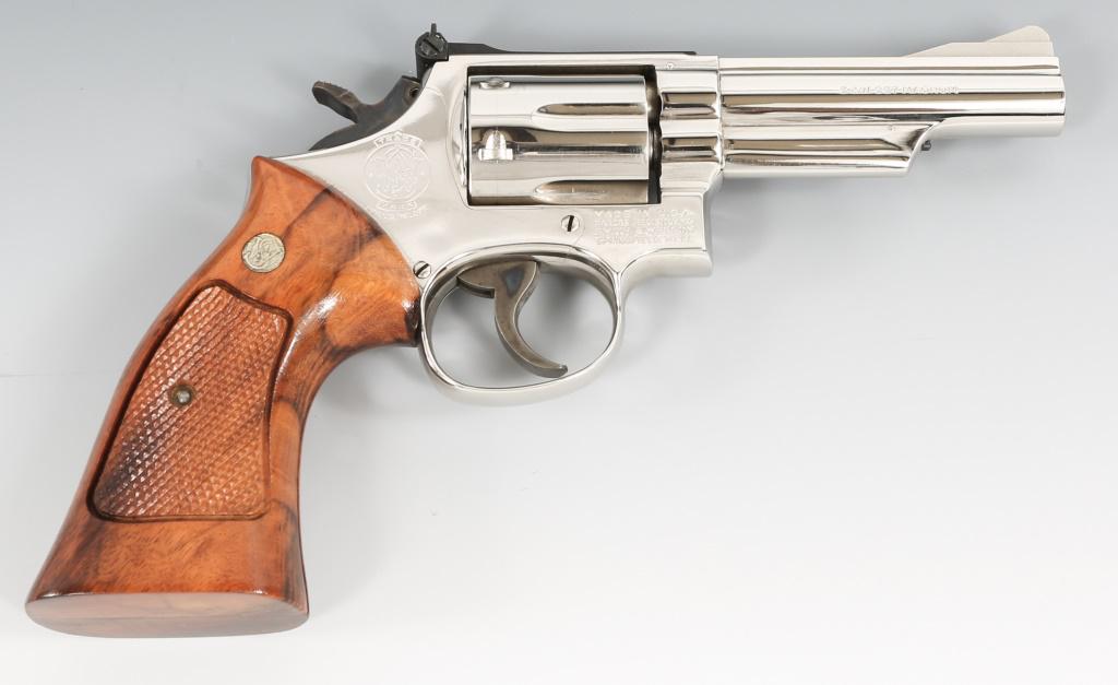 SMITH & WESSON MODEL 19-4 .357 MAGNUM REVOLVER: SMITH & WESSON MODEL 19-4 .357 MAGNUM REVOLVER Smith & Wesson model 19-4 .357 Magnum revolver. Stainless finish, light walnut grips. Factory manuals. Frame number: "47K2264." Grip frame reads: "C16," 