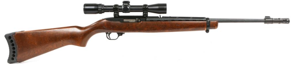 RUGER MODEL 10/22 .22 LR CALIBER CARBINE: RUGER MODEL 10/22 .22 LR CALIBER CARBINE Ruger model 10/22 .22 LR Carbine with Bushnell Sportview 3X-9X32mm scope. No magazine. Flash suppressor installed. Walnut stock, blued finish. Caliber / Gauge: