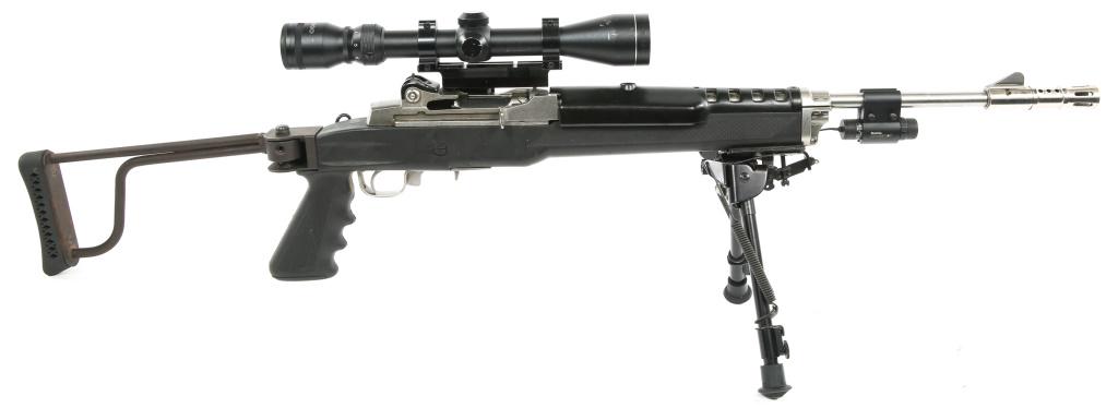 RUGER MINI-14 SEMI-AUTOMATIC .223 RIFLE: RUGER MINI-14 SEMI-AUTOMATIC .223 RIFLE Ruger Mini-14 semi-automatic .223 rifle with Tasco 3-9x40MM scope. Folding buttstock, recoil and flash suppressor, Quarton Beamshot laser, and bipod affixed. No