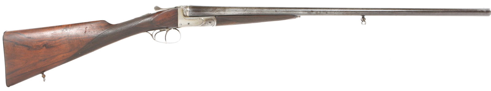 ST. ETIENNE 16 GAUGE SIDE BY SIDE SHOTGUN: ST. ETIENNE 16 GAUGE SIDE BY SIDE SHOTGUN French St. Etienne 16 gauge side-by-side shotgun. Checkered walnut stock, blued finish. Floral engraving on receiver. Crown over "PT" proof marks. Bottom of b