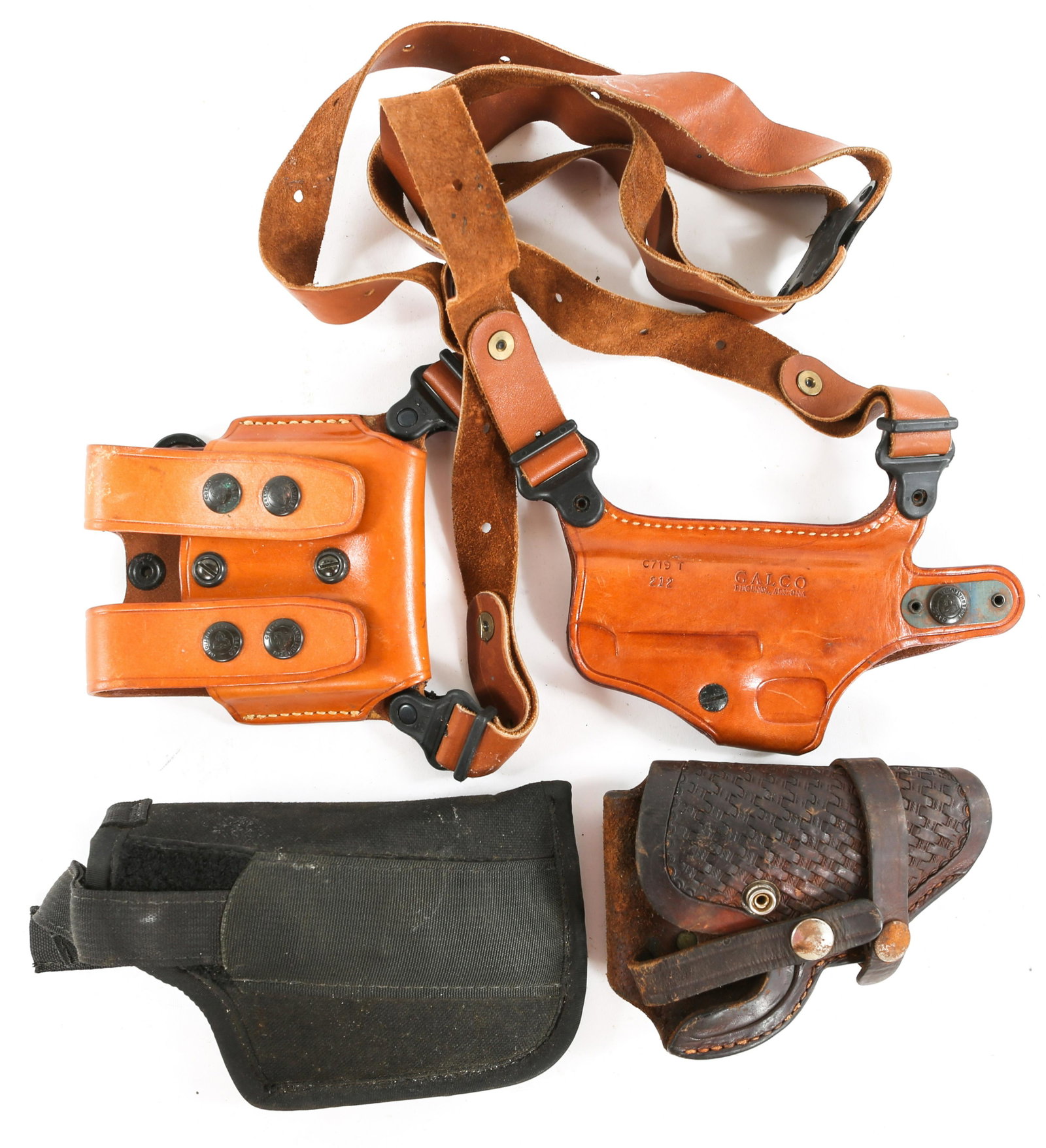 PISTOL HOLSTER LOT OF 3: PISTOL HOLSTER LOT OF 3 One Galco model C719 T 212 leather shoulder holster with magazine holster. One Viking Mexico leather pistol holster. One Uncle Mikes size 15 nylon holster.