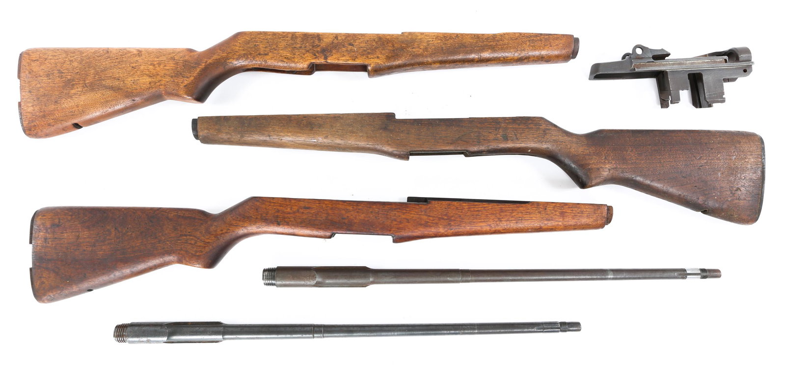 NATIONAL ORDNANCE M1 RECEIVER AND PARTS LOT: NATIONAL ORDNANCE M1 RECEIVER AND PARTS LOT National Ordnance receiver serial number 1170. Two M1 barrels measuring 24". Three wooden M1 stocks. Size / Gauge: .30-06