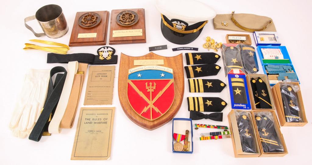 VIETNAM WAR ERA US NAVY OFFICER ARCHIVE: VIETNAM WAR ERA US NAVY OFFICER ARCHIVE Vietnam War era, US Navy LTJG Gary S. Fleck archive. Includes: white dress hat, lot of Officer shoulder boards, medals, ribbons, pins and insignias, 3- plaques,