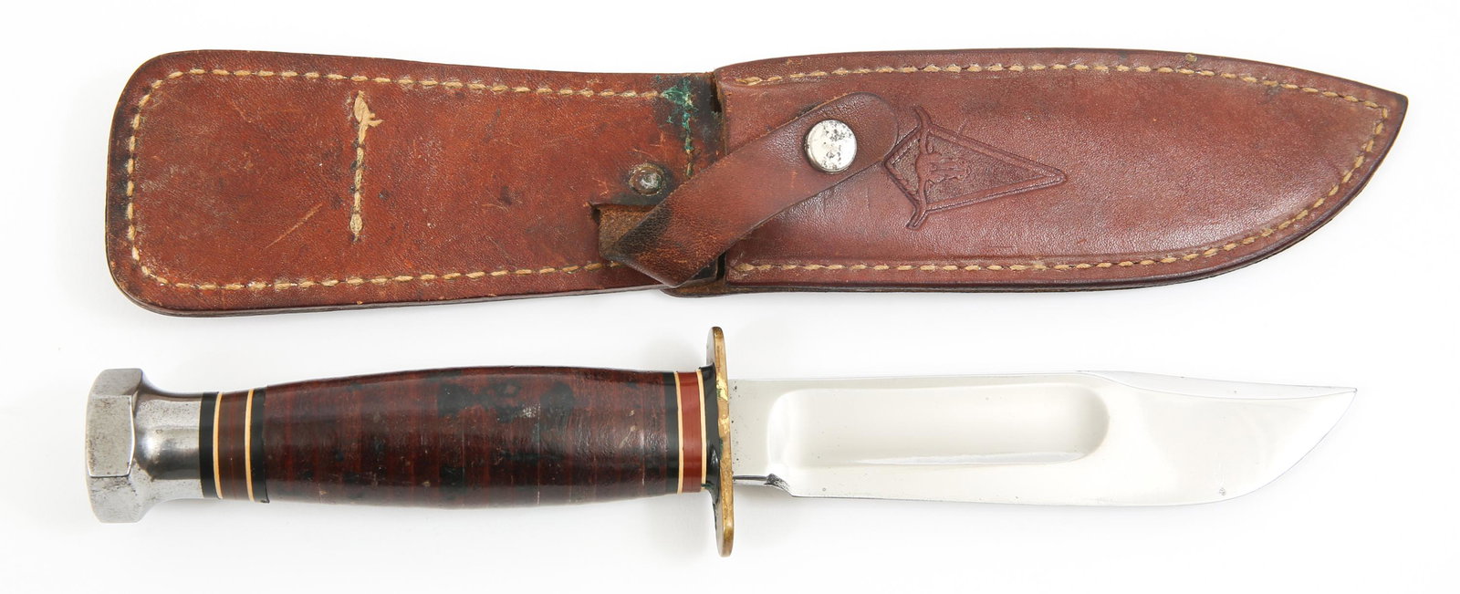 VINTAGE MARBLES LONGHORN SERIES 5" BLADE KNIFE: VINTAGE MARBLES LONGHORN SERIES 5" BLADE KNIFE Circa 1960's Marbles Longhorn series hunting knife. 5" clip point blade with fuller, hexagonal pommel, brass double hilt, stacked leather handle with dar