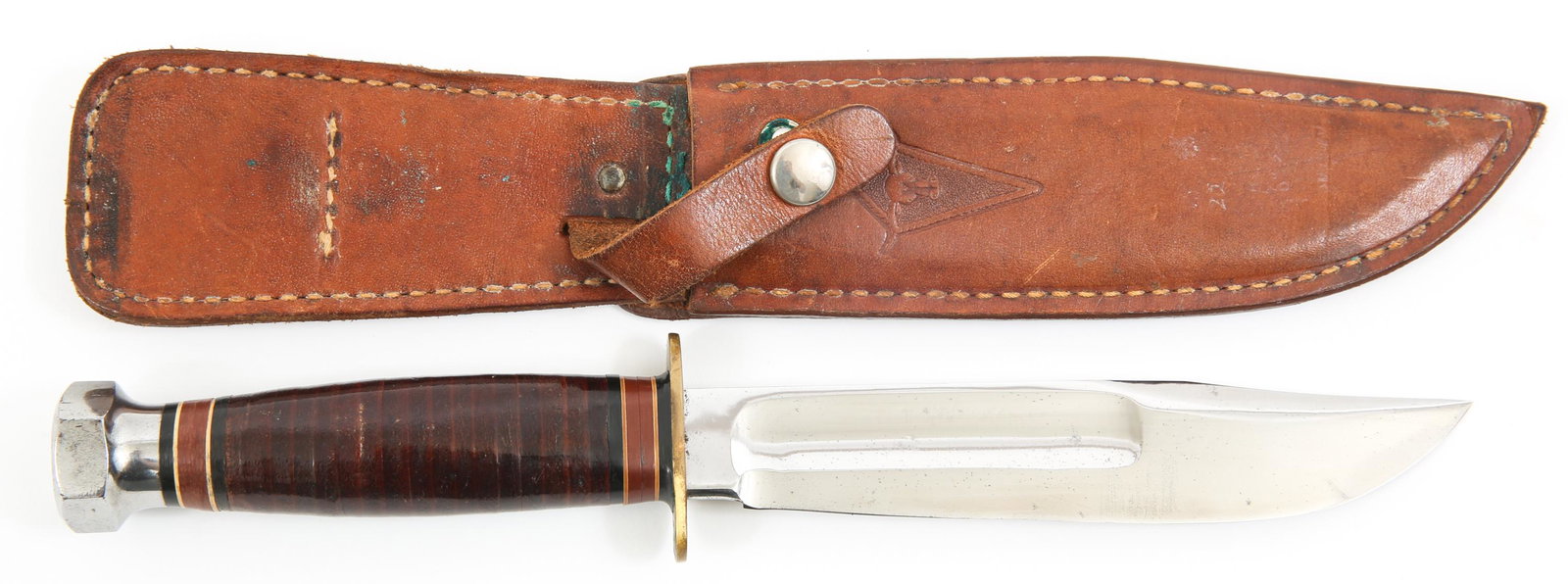VINTAGE MARBLES LONGHORN SERIES 6" BLADE KNIFE: VINTAGE MARBLES LONGHORN SERIES 6" BLADE KNIFE Circa 1960's Marbles Longhorn series hunting knife. 6" clip point blade with fuller, hexagonal pommel, brass double hilt, stacked leather handle with dar
