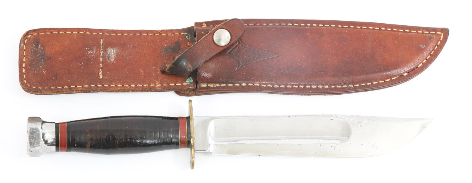 VINTAGE MARBLES LONGHORN SERIES 7" BLADE KNIFE: VINTAGE MARBLES LONGHORN SERIES 7" BLADE KNIFE Circa 1960's Marbles Longhorn series hunting knife. 7" clip point blade with fuller, hexagonal pommel, brass double hilt, stacked leather handle with dar
