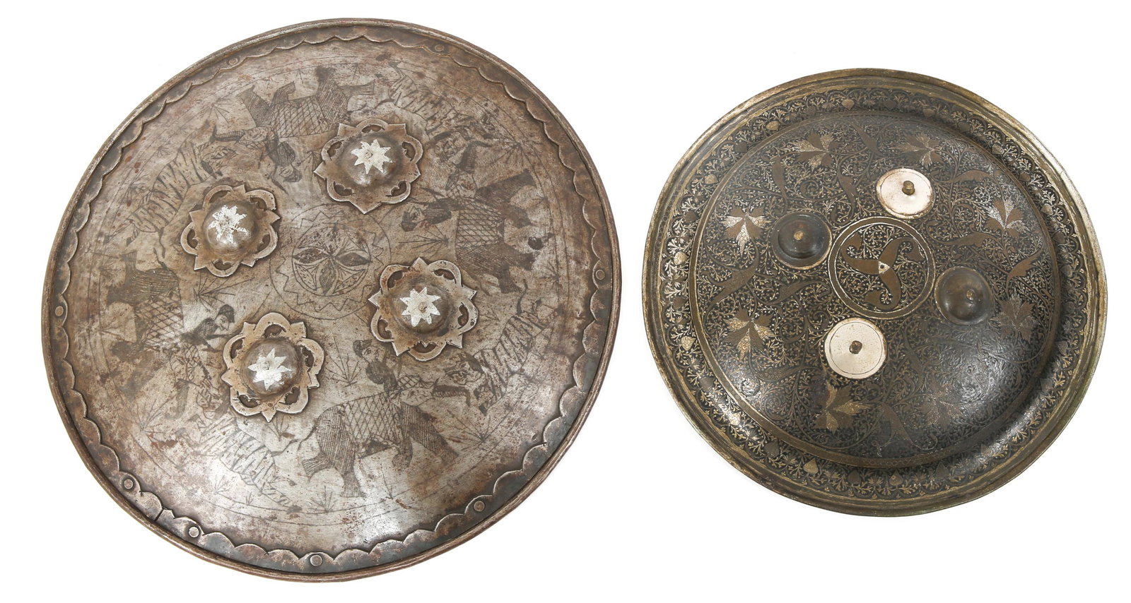 INDO-PERSIAN DHAL SEPAR SHIELDS LOT OF 2: INDO-PERSIAN DHAL SEPAR SHIELDS LOT OF 2 Lot of 2 Indo Persian Dhal Separ shields. (1) four studded shield decorated with repousse & black enamel 11.5" in diameter, (2) four studded shield with engrav