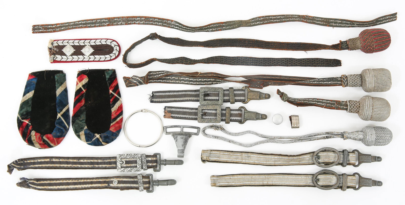 MIXED 20TH C. WORLD MILITARY PORTEPEE & HANGER LOT: MIXED 20TH C. WORLD MILITARY PORTEPEE & HANGER LOT Large assortment of world military (mostly European) edged weapon Portepees & Hangers. Lot includes: 3 silver bullion wire portepee, 1 red & silver p