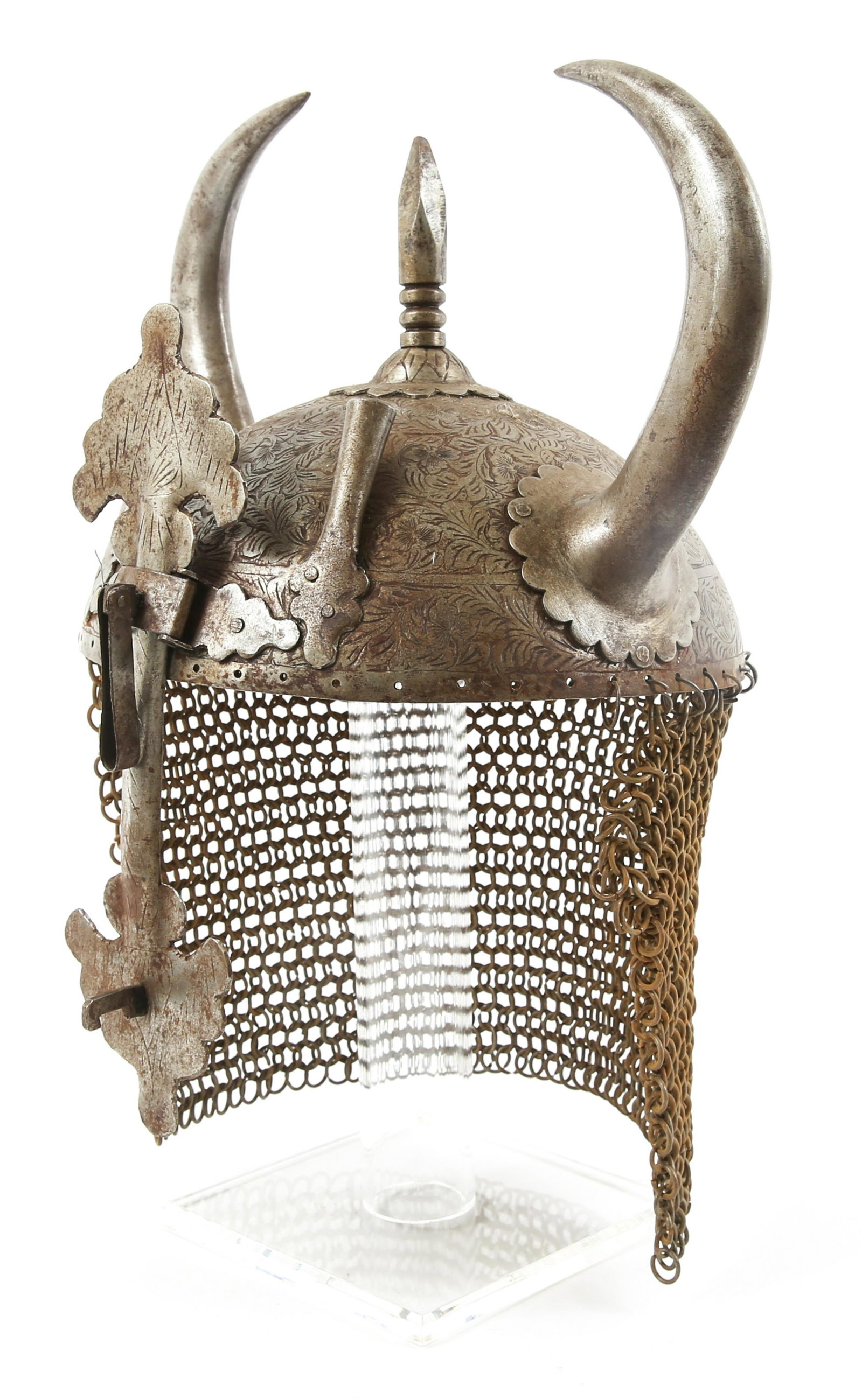 INDO PERSIAN OTTOMAN KULAH KHUD HORNED HELMET: INDO PERSIAN OTTOMAN KULAH KHUD HORNED HELMET Engraved skull with dual curved horns common of the Indo Persian Ottoman army. Spiked top with dual plume holders on both sides of central sliding nasal g