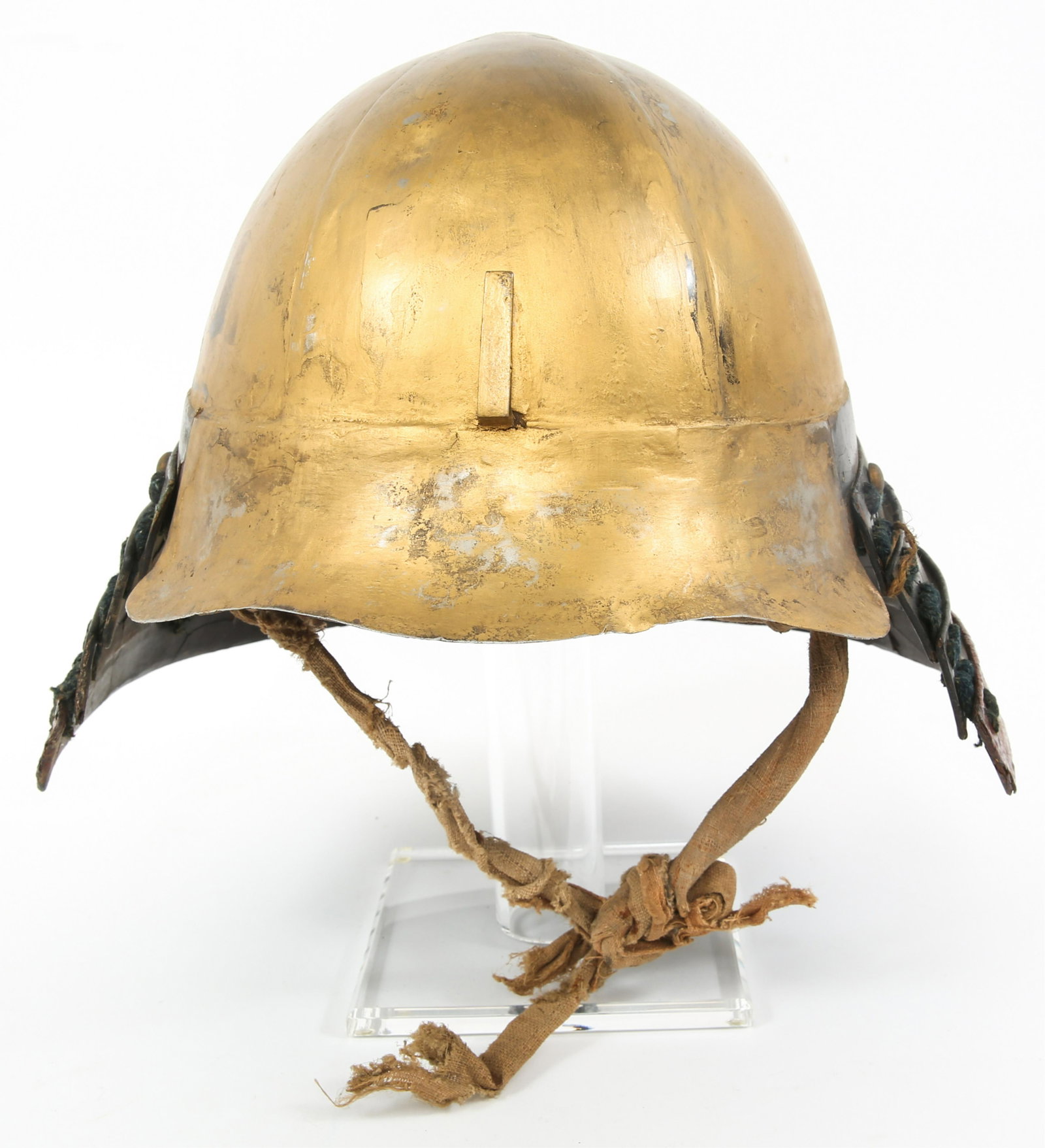 EDO JAPANESE SAMURAI KABUTO HELMET WITH SHIKORO: EDO JAPANESE SAMURAI KABUTO HELMET WITH SHIKORO Japanese Kabuto helmet. Multiple piece Hachi construction. Some of the original lacquer remains. Original Oharaidate intact for frontal Datemono fasteni